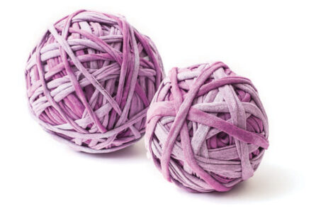 two balls of purple t-shirt yarn